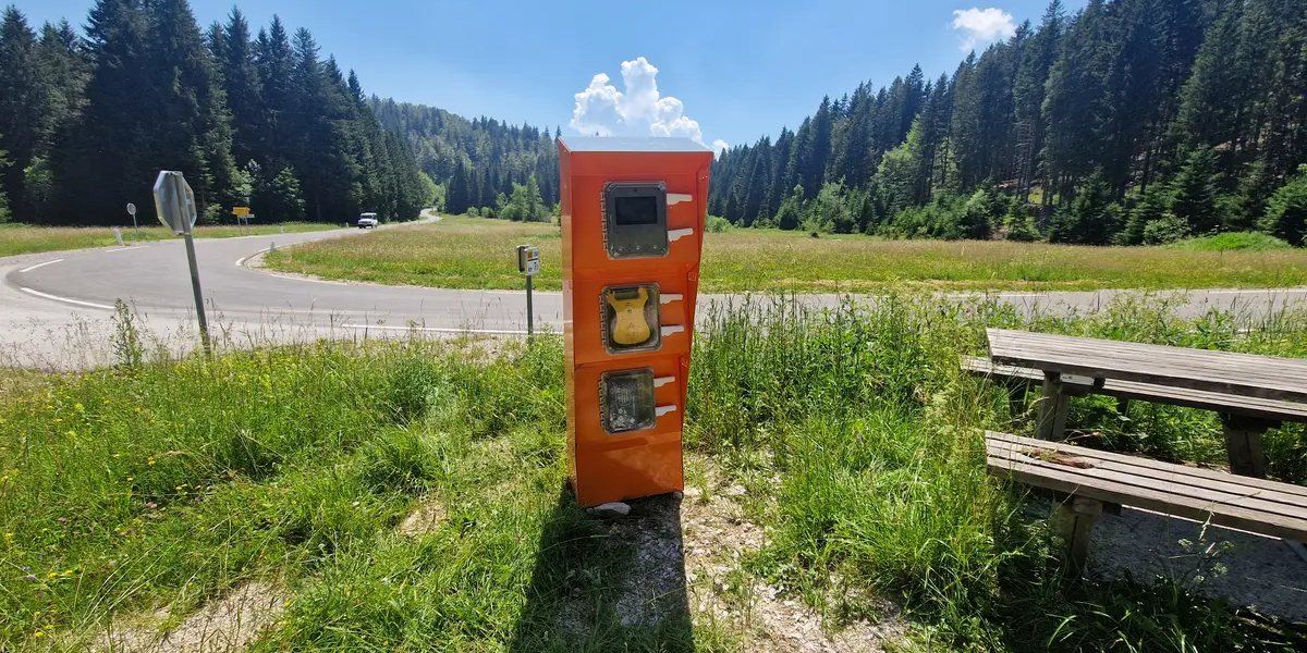 SOS Točka emergency point installed at a remote location in the mountains.